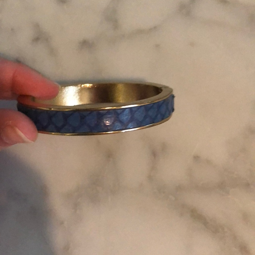 Gold cuff bracelet with blue snake skin inlay